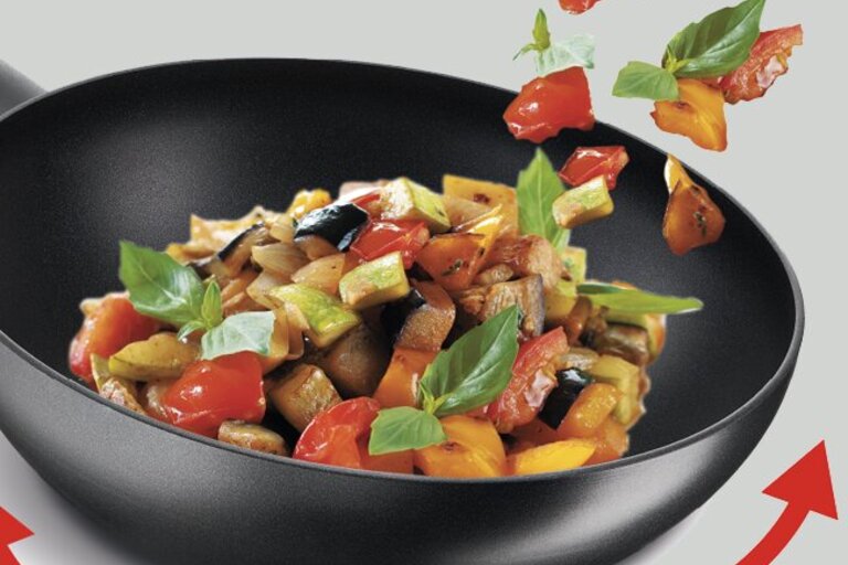 Hvad er forskellen på en wok og en traktørpande?